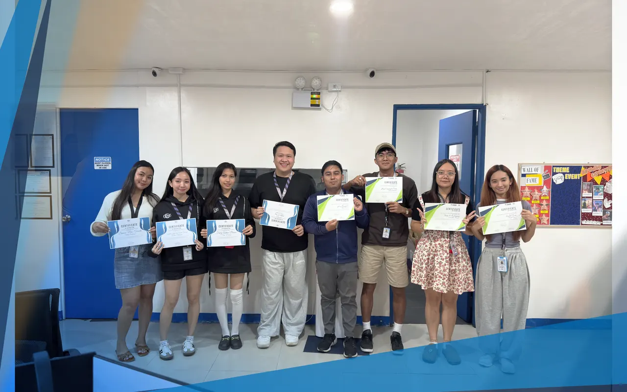 Ten team members holding certificates of recognition
